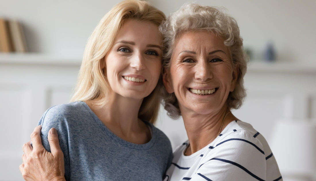 Two women smiling together, reflecting how social connection and healthy habits can support mental wellbeing.