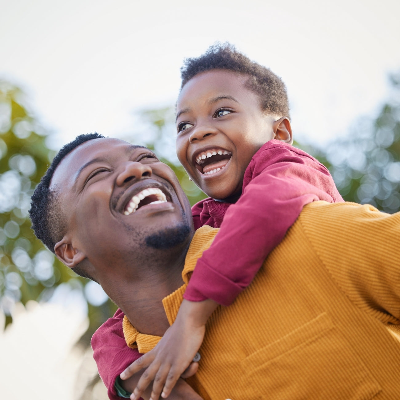 Father_and_Son_Outside_with_Son_on_Dad_s_Back.jpg