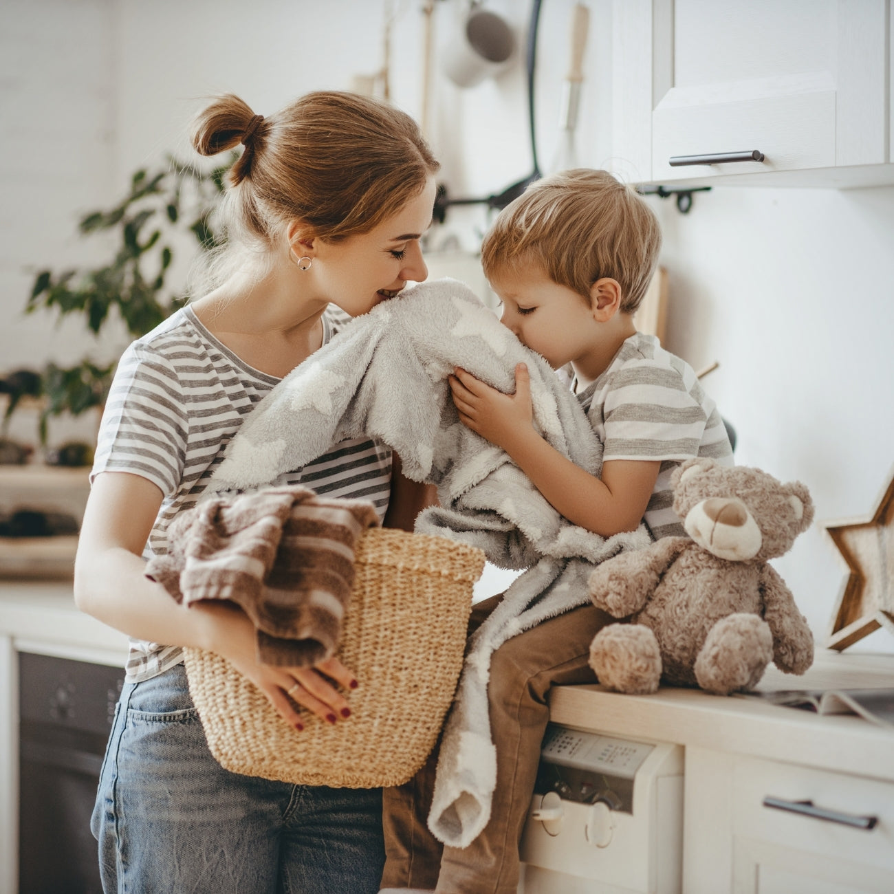 Mom_and_Son_Doing_Laundry_with_Teddy_Bear_Displaying_Executive_Function_3.jpg